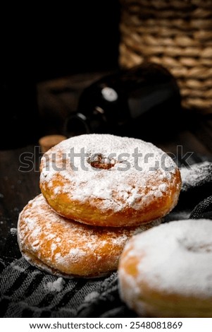 Similar – Image, Stock Photo Person pouring sugar powder with tea strainer above cake