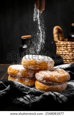 Similar – Image, Stock Photo Person pouring sugar powder with tea strainer above cake