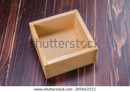 empty wooden box on wooden board background