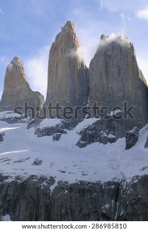 El Torres del Paine, Chile. The three towers with snow in late afternoon. Clear sky.