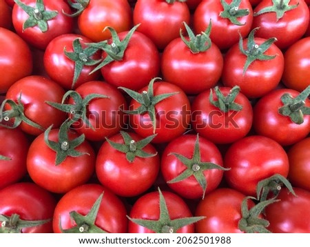 Macro photo red cherry tomatoes. Stock photo vegetable red cherry tomato background