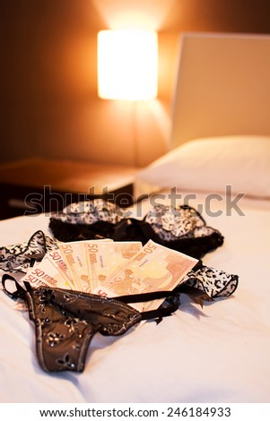 Underware, bed and money to symbolize the cost of sex.