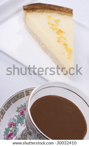 Cup of coffee and a slice of Lemon Tart.