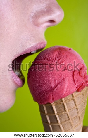 Biting a red ice cream