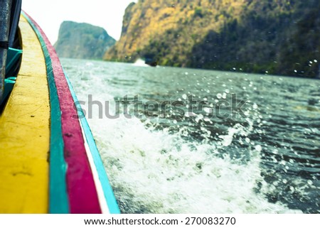 ships edge and blurry of Splashing water - Blurry Nature in the sea at Phang Nga Bay