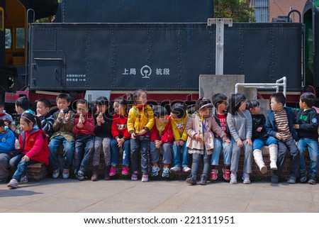 Shanghai, China - Jan 8, 2014: Unidentified Chinese children, aged around 8 years old students, visiting Shanghai railway museum.