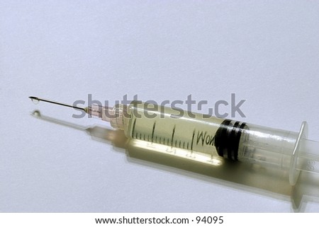 A hypodermic needle against a white background.