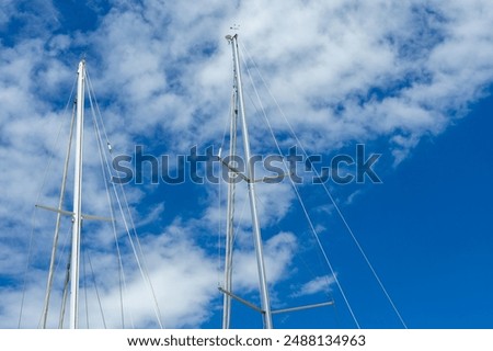 Similar – Image, Stock Photo Knotted remainder of an orange fluttering band on a rusty iron bar of a fence in front of a brown background