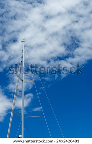 Similar – Image, Stock Photo Knotted remainder of an orange fluttering band on a rusty iron bar of a fence in front of a brown background