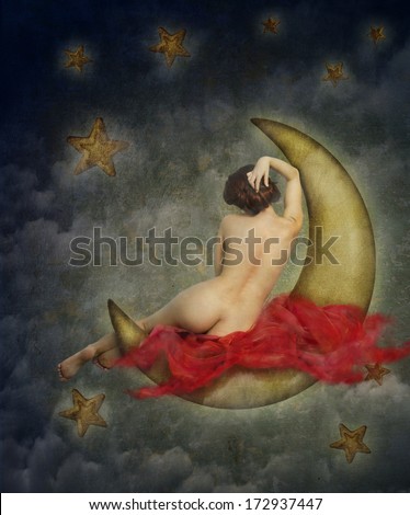beautiful naked woman sitting on the paper moon