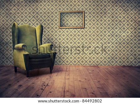 Vintage room with wallpaper and old fashioned armchair