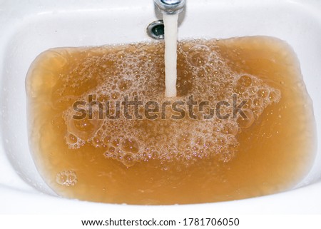 Similar – Image, Stock Photo Contaminated brown water in a pond in nature