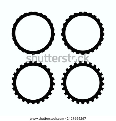 Perforated edge hollow circle stroke shapes. A group of four circular symbols with notched outside edges. Isolated on a white background.