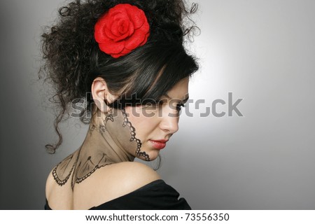 Beautiful woman with fashion hairstyle and body painting