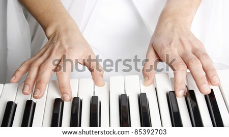 Woman playing piano in the concert