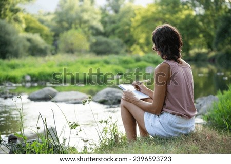 Similar – Image, Stock Photo Unrecognizable woman near forest river