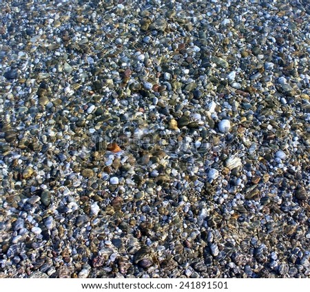 River pebbles through the water