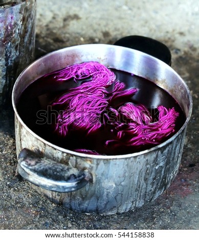 Dayer ancient craft making colors pot with fabric and natural additives, preparation of color filtering with the addition of additives and holding the mixture to soak  Stock fotó © 