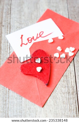 Red envelope with note and hearts