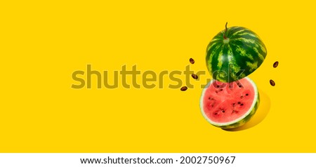 Floating, levitating sliced fresh watermelon with a tail,seeds on yellow background.Summer fruits,berries.Bold color.Trendy,minimal shadows.Creative food. Concept of watermelon day-August 3.Copy space