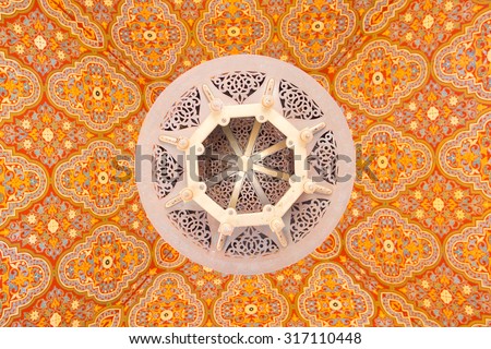 Moroccan ceiling lamp with traditional design on the colorful ceiling
