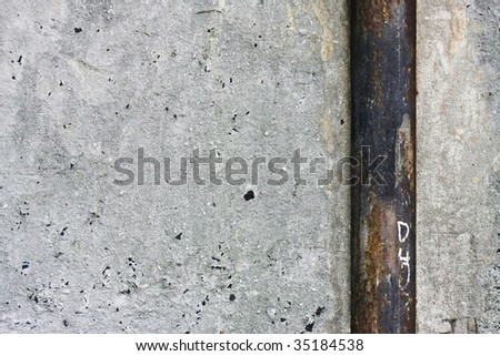 grunge wall with rusty pipe