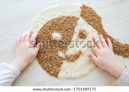 Similar – Image, Stock Photo Female hand make buckwheat balls on kitchen table background with herbs and spices, top view. Healthy homemade food