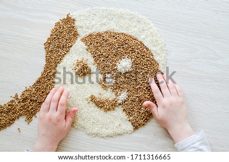 Similar – Image, Stock Photo Female hand make buckwheat balls on kitchen table background with herbs and spices, top view. Healthy homemade food