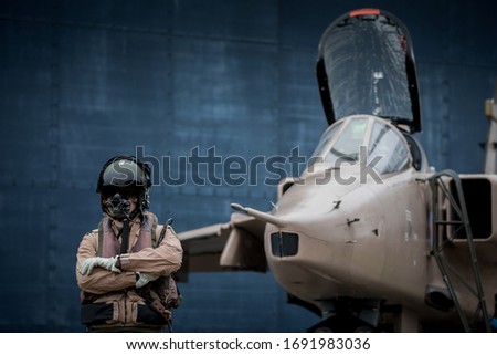 Royal Air force (RAF) Jaguar strike attack fighter jet with pilots wearing flying suits and helmets ready to fly their aeroplanes.  Zdjęcia stock © 