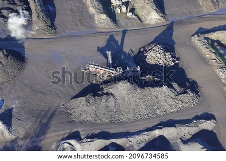 An aerial view taken from a helicopter of a aggregate crushing and grading machine. Looking down of a grey yard of crushed building materials in Wales. Foto stock © 