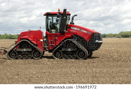 RIVER FALLS,WISCONSIN-JUNE 2, 2014: A Case Quadtrac Tractor in a Spring field in River Falls,Wisconsin on June 2, 2014