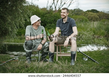 Image, Stock Photo two fishermen in a boat with reflection in a still river water at twilight on autumn landscape.