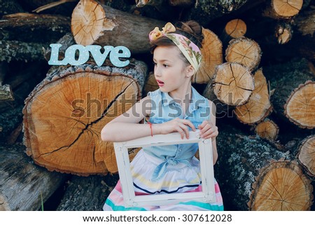nice little model posing on a background of wooden beams