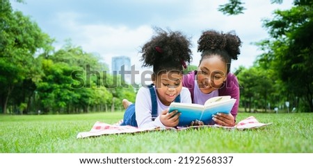 Similar – Image, Stock Photo Interested woman reading book at window sill at home