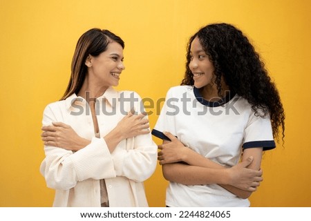 Similar – Image, Stock Photo Delighted black lesbian couple taking selfie on smartphone