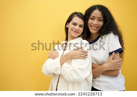 Similar – Image, Stock Photo Delighted black lesbian couple taking selfie on smartphone