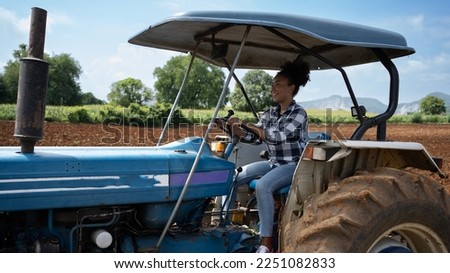 Image, Stock Photo Female farmer with tractor on olive plantation