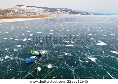 Similar – Foto Bild Eisfläche mit eingefrorenem Schilf und Schnee.