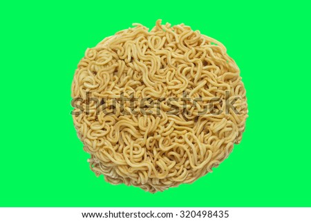 A circle of uncooked Ramen Noodles Isolated on green screen chroma key background.