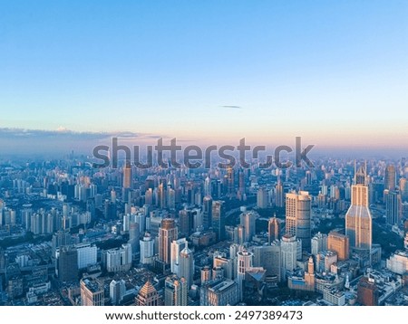 Similar – Foto Bild Skyline-Ansicht über den Wolken aus dem Flugzeug