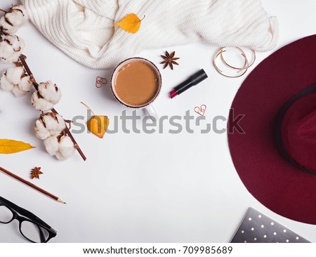 Similar – Image, Stock Photo Women fashion composition. Warm winter female woollen knitted sweaters, pullovers stack on a wooden stool at white background. Modern clothes concept for magazine, blog, social media.