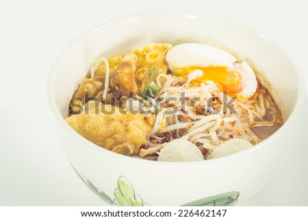 Thai noodle soup in a bowl on a white background taste spicy noodle soup