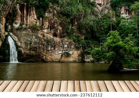 Chattrakan Waterfall in Thailand water fall in deep forest at border of Phitsanulok province Thailand and bamboo floor