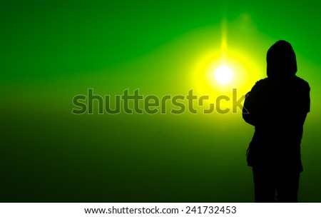 silhouette man standing on colorful sun light background