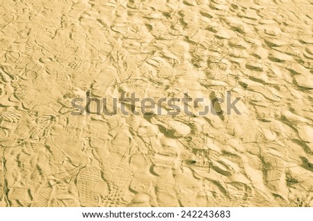 closeup of footprint on sand texture  , gold sand filter