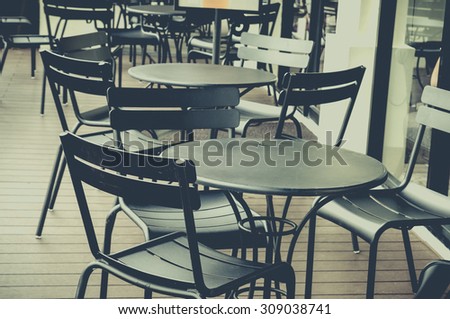 vintage tone process font of coffee shop and group of chair