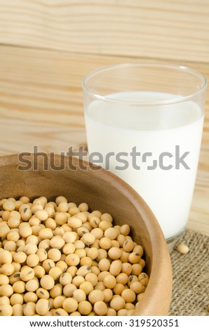 soy Milk with soy bean on wood background