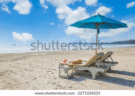 Similar – Image, Stock Photo Empty beach with empty sunbeds and umbrellas without guests