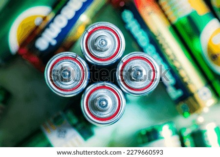 Similar – Image, Stock Photo Several new alkaline batteries in one size in rows