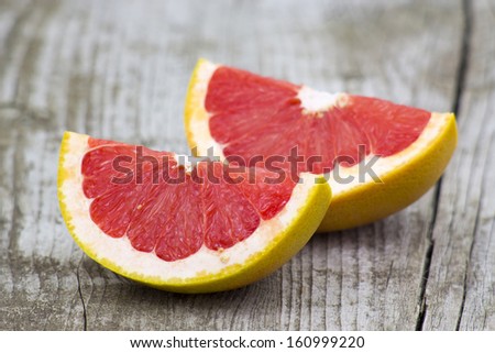 red grapefruit on old wooden background